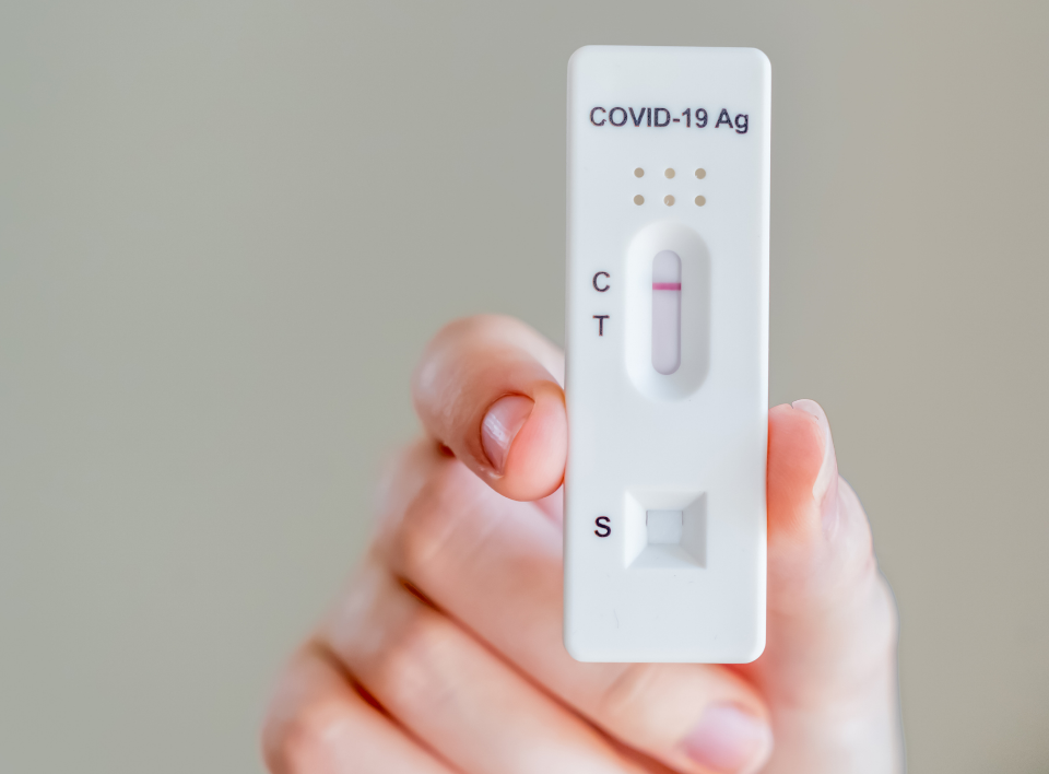 holding-a-rapid-antigen-test